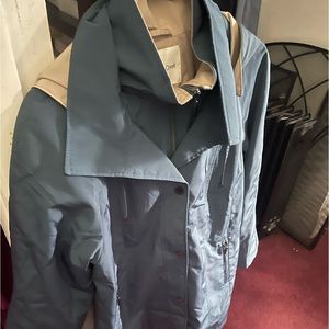 This Beautiful Petrol Blue Raincoat with Hood   Size L  zipper pockets.